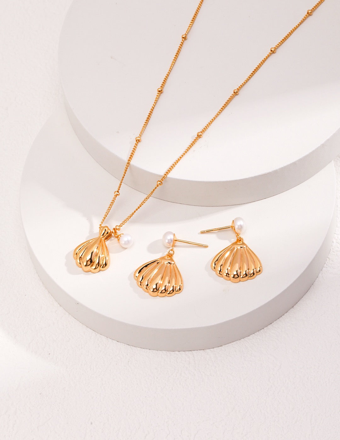Pendant of shell and pearl necklaces