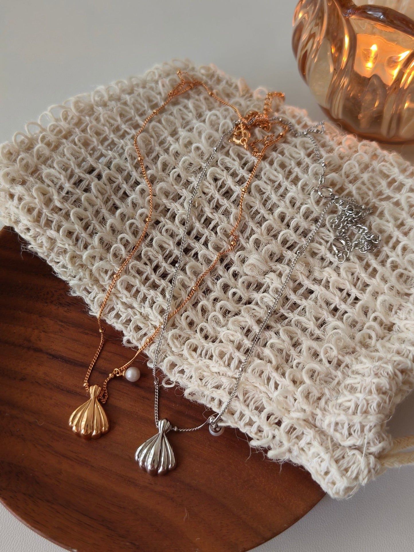 Pendant of shell and pearl necklaces