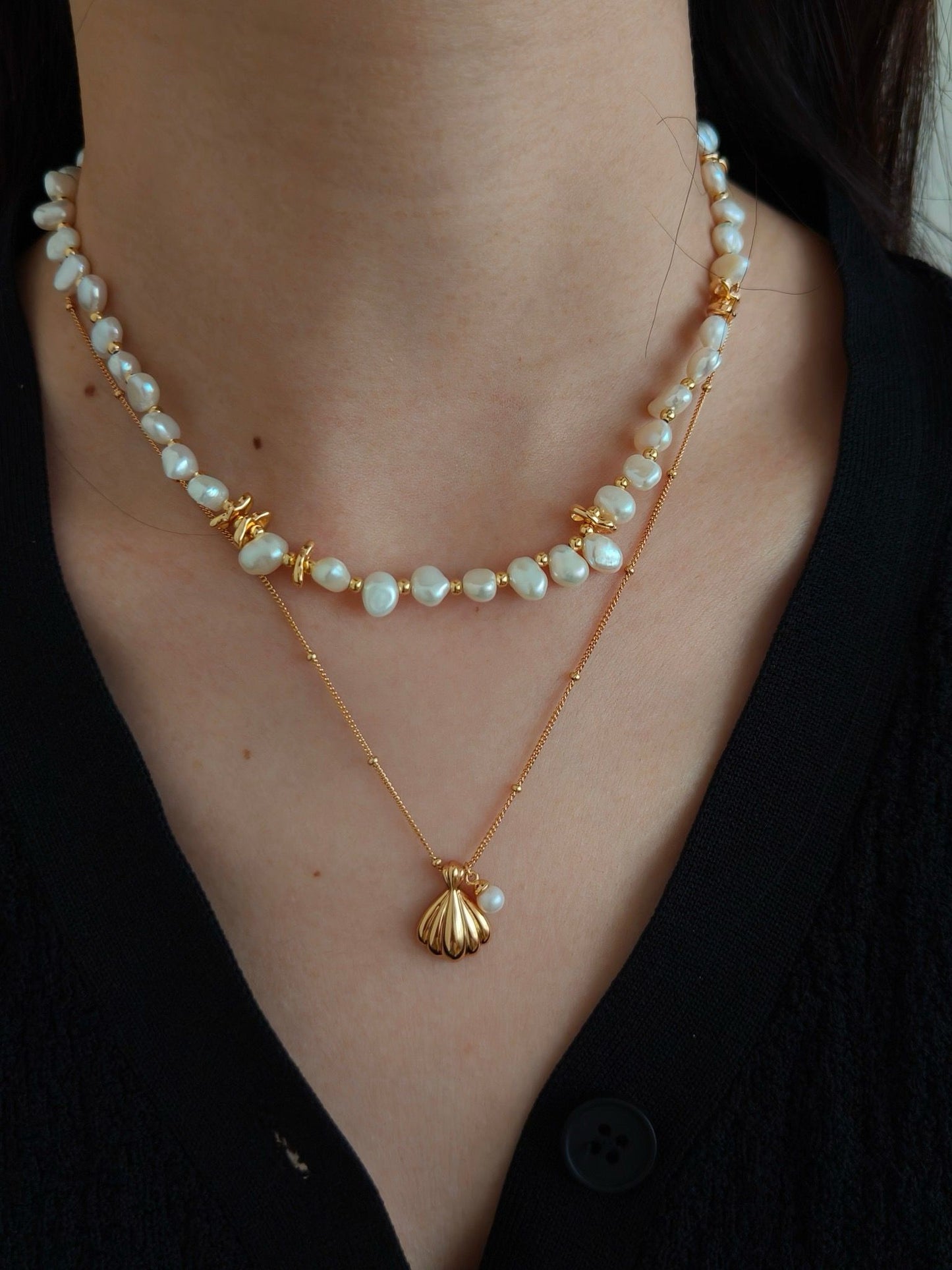 Pendant of shell and pearl necklaces